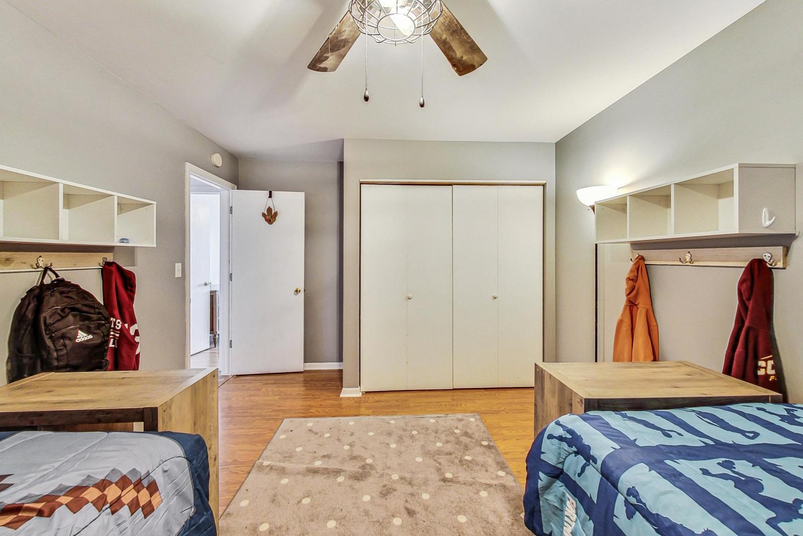 510 Porten Road Island Lake, IL 60042 - Photo 17 of 29 a bedroom with bed and walk in closet