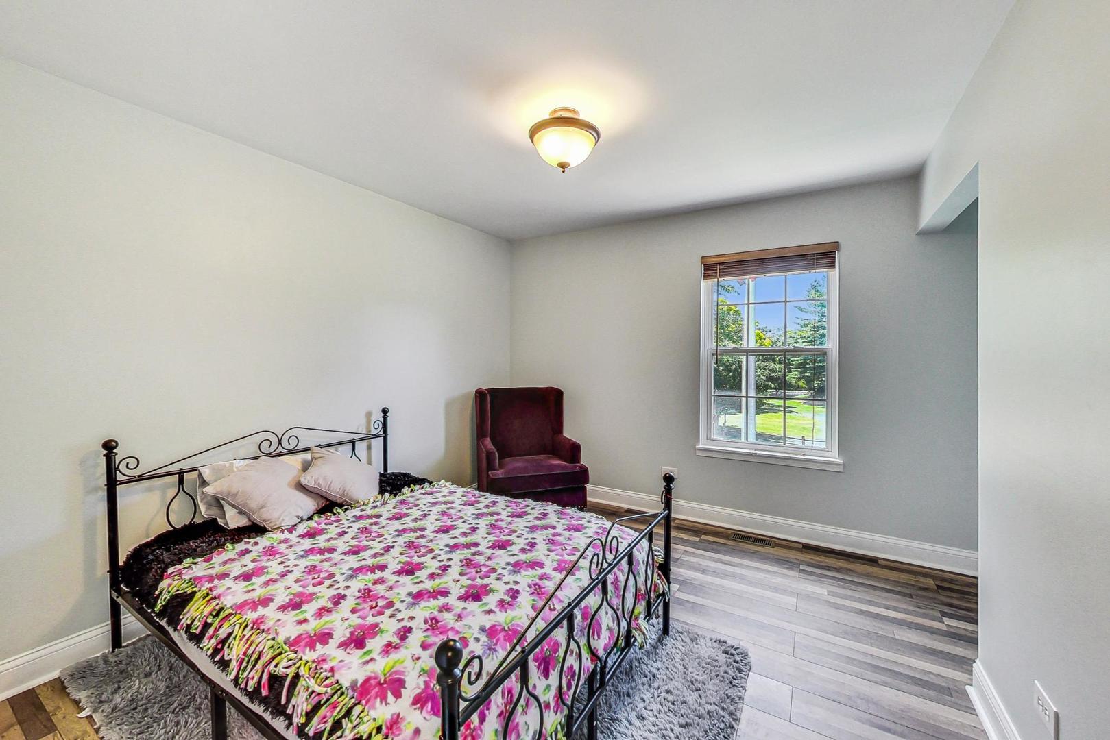 510 Porten Road Island Lake, IL 60042 - Photo 18 of 29 a bedroom with a bed and a window
