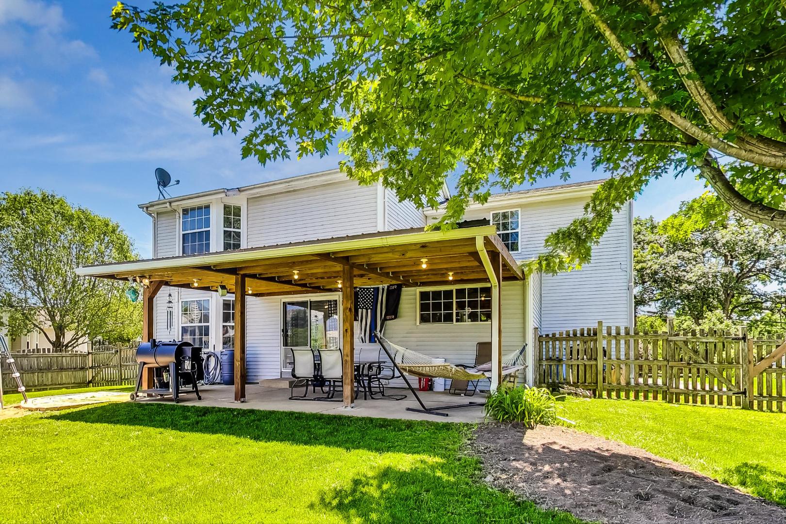 510 Porten Road Island Lake, IL 60042 - Photo 22 of 29 a view of a house with a yard porch and sitting area