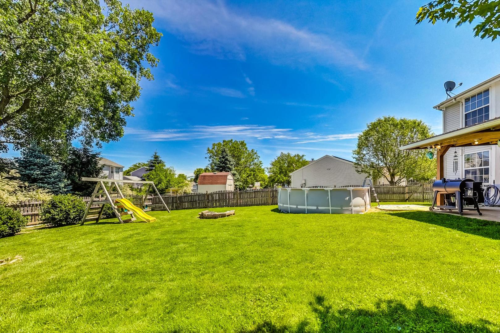 510 Porten Road Island Lake, IL 60042 - Photo 26 of 29 a view of a house with a big yard and large trees