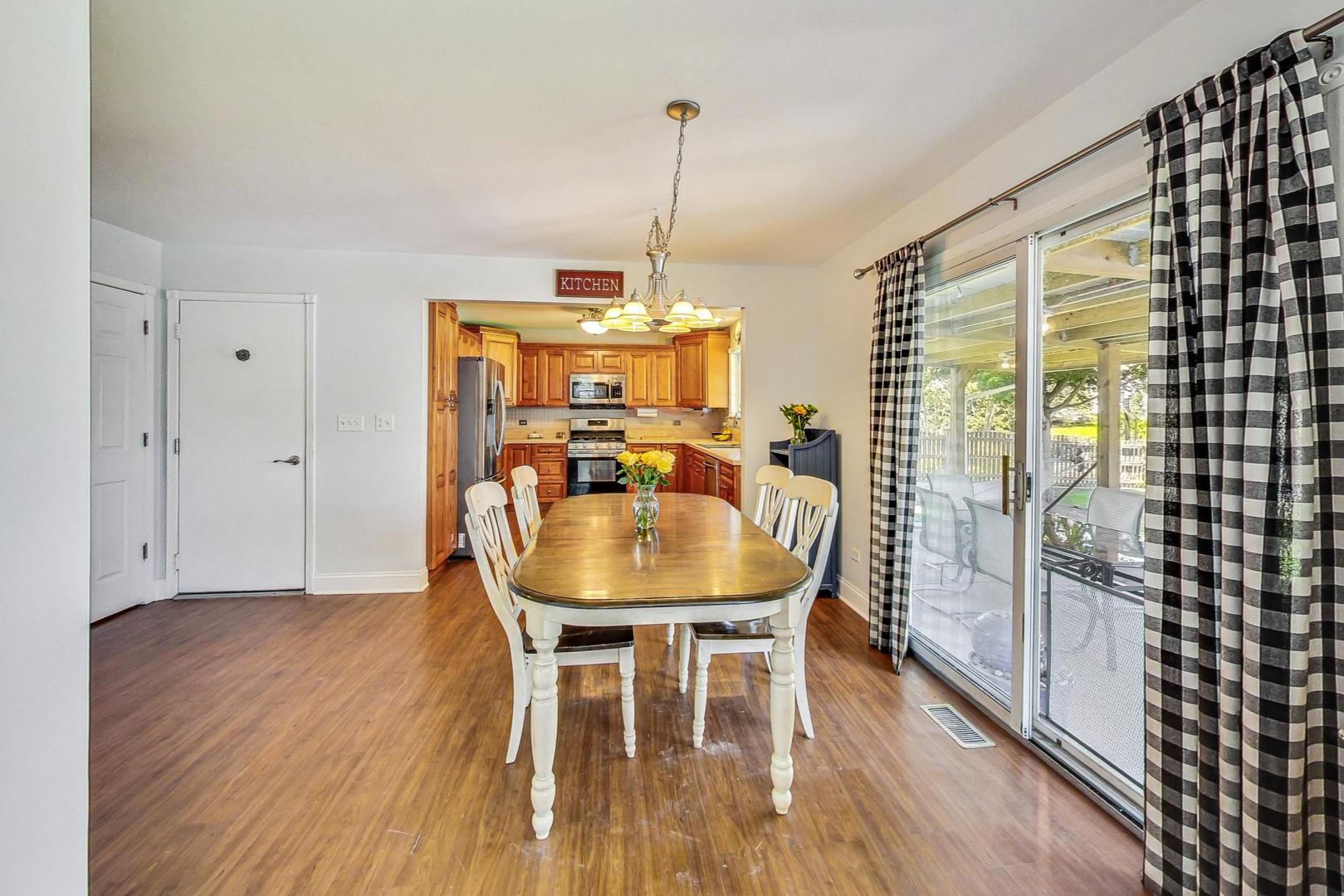 510 Porten Road Island Lake, IL 60042 - Photo 7 of 29 a dining room with furniture window wooden floor