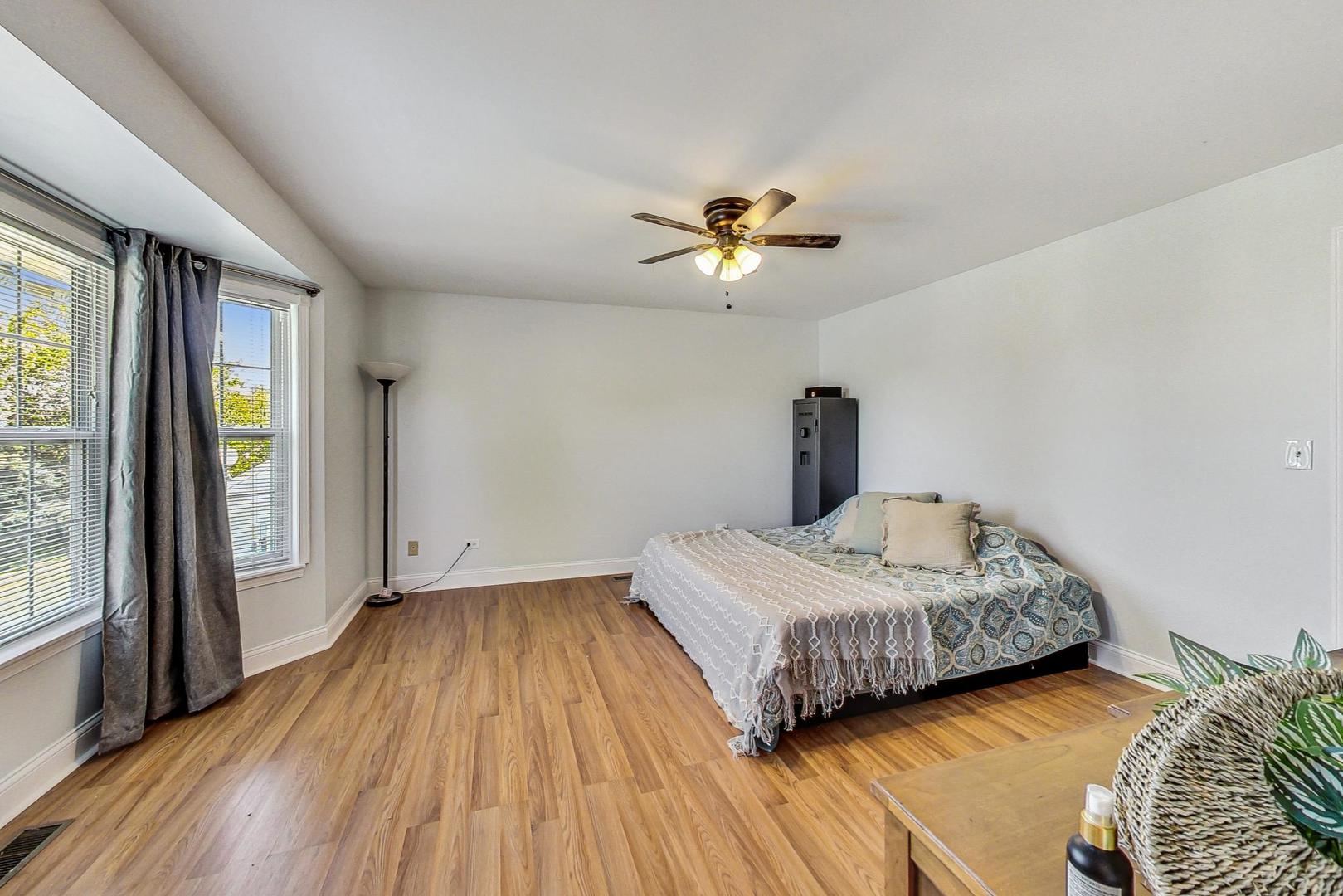 510 Porten Road Island Lake, IL 60042 - Photo 10 of 29 a bedroom with a bed and a window