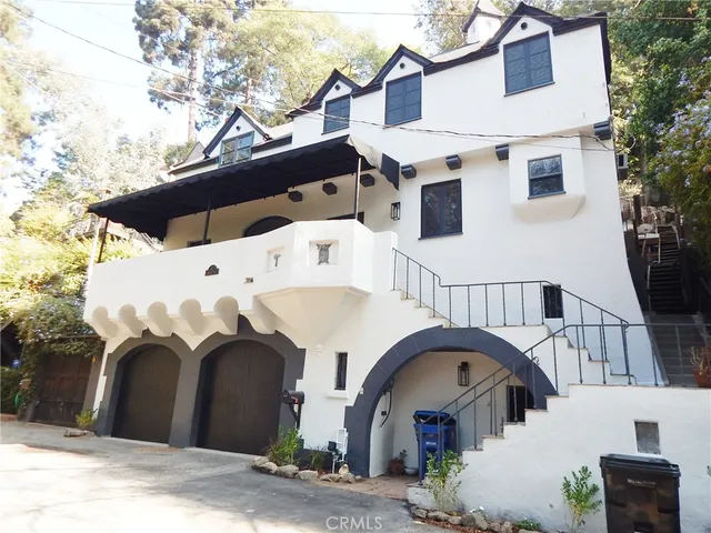 a front view of a house with entrance gate