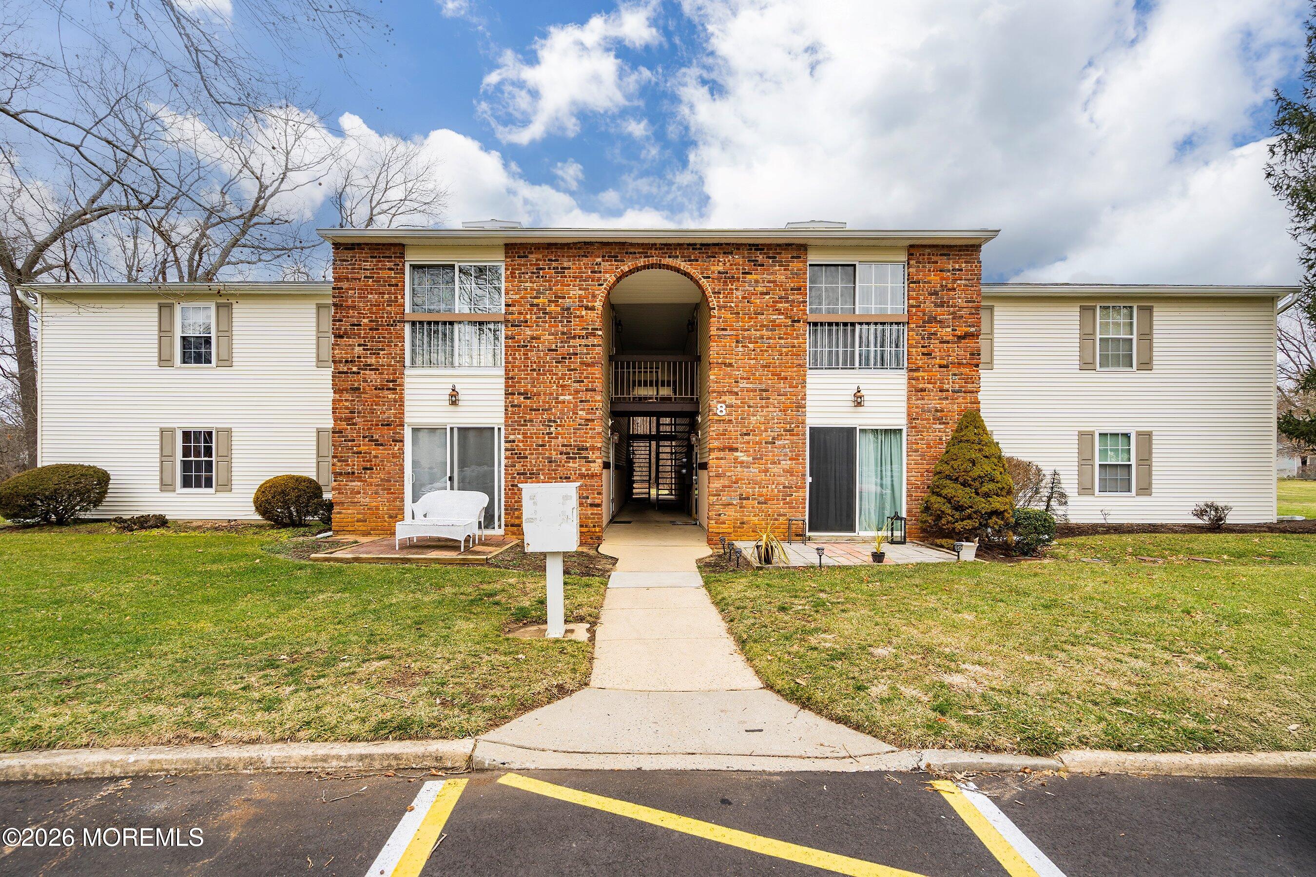 8-2 Seattle Court Freehold, NJ 07728 - Photo 1 of 35 a front view of a house with garden