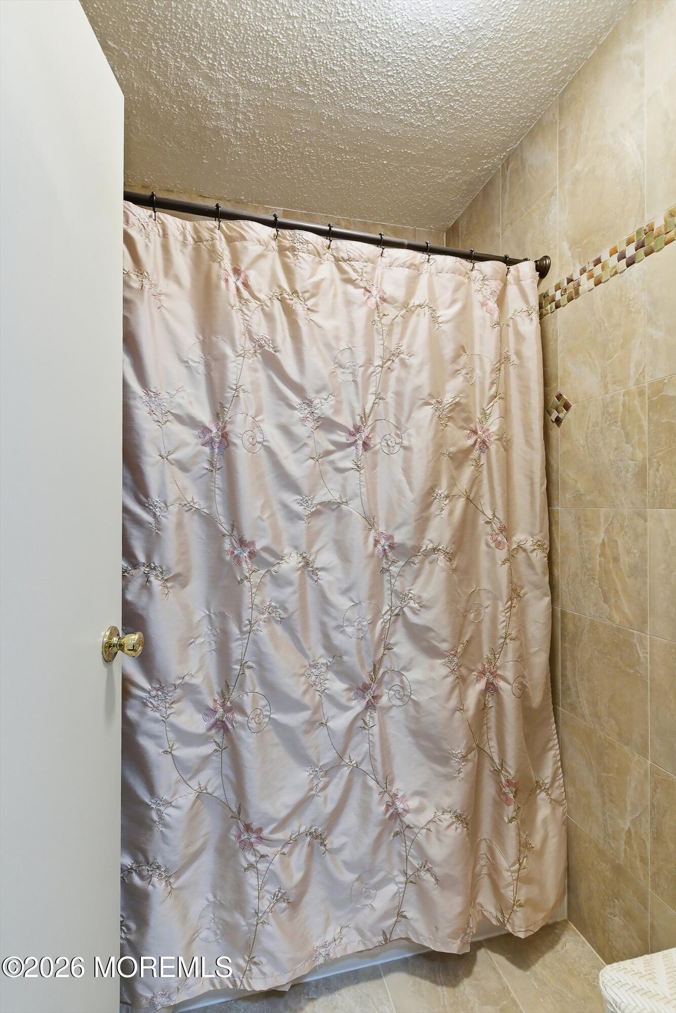 8-2 Seattle Court Freehold, NJ 07728 - Photo 19 of 35 a bathroom with a shower curtain