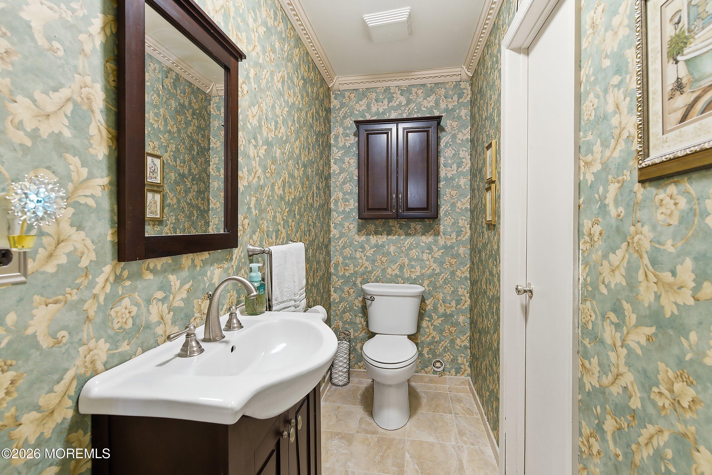 8-2 Seattle Court Freehold, NJ 07728 - Photo 21 of 35 a bathroom with a toilet sink and mirror