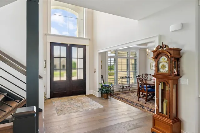 a kitchen with stainless steel appliances granite countertop a sink a stove and a refrigerator