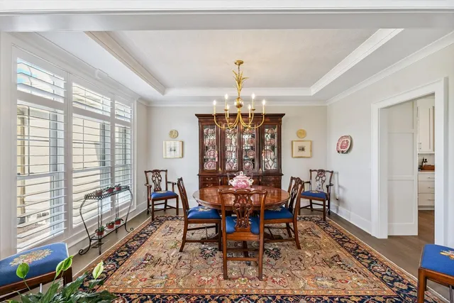 a kitchen with stainless steel appliances granite countertop white cabinets sink and dishwasher with wooden floor
