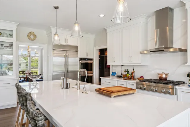 a bathroom with double vanity sinks a vanity a mirror and a shower