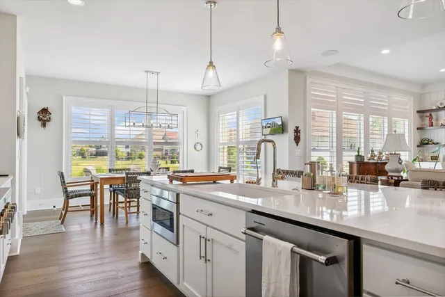 a kitchen with stainless steel appliances a sink stove and refrigerator