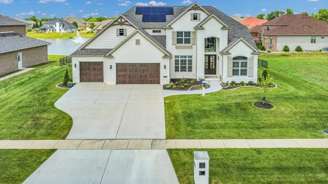 a view of a hallway with wooden floor and windows