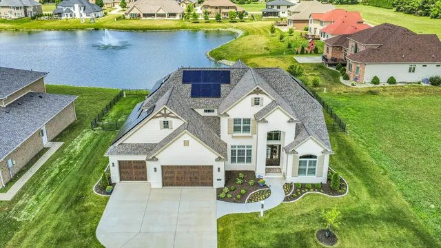 a dining room with furniture a chandelier and wooden floor