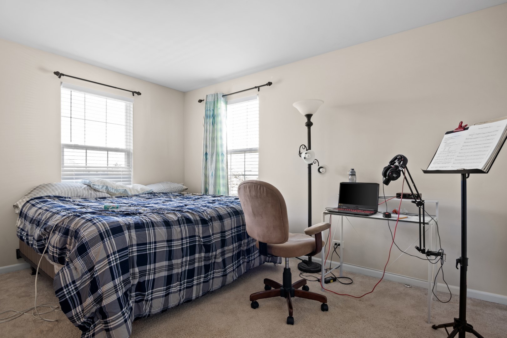 2919 Church Road Aurora, IL 60502 - Photo 20 of 28 a bedroom with a bed a desk chair and windows