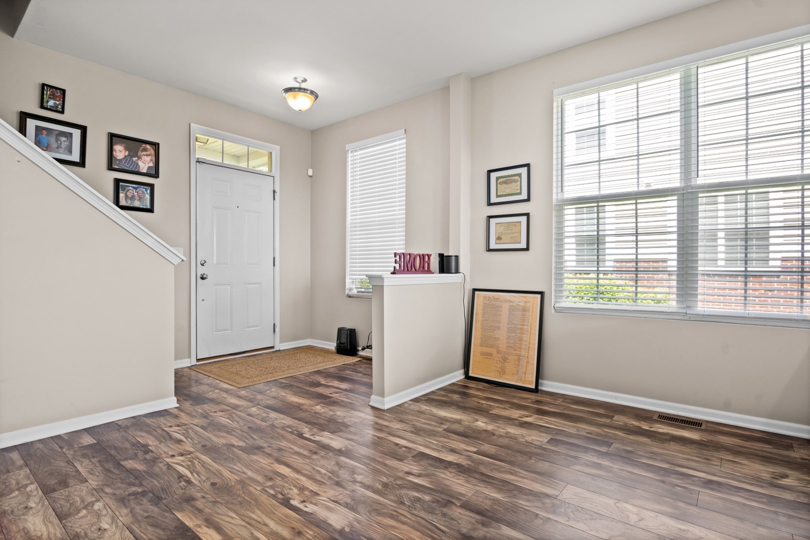 2919 Church Road Aurora, IL 60502 - Photo 4 of 28 a view of a kitchen with wooden floor and white walls