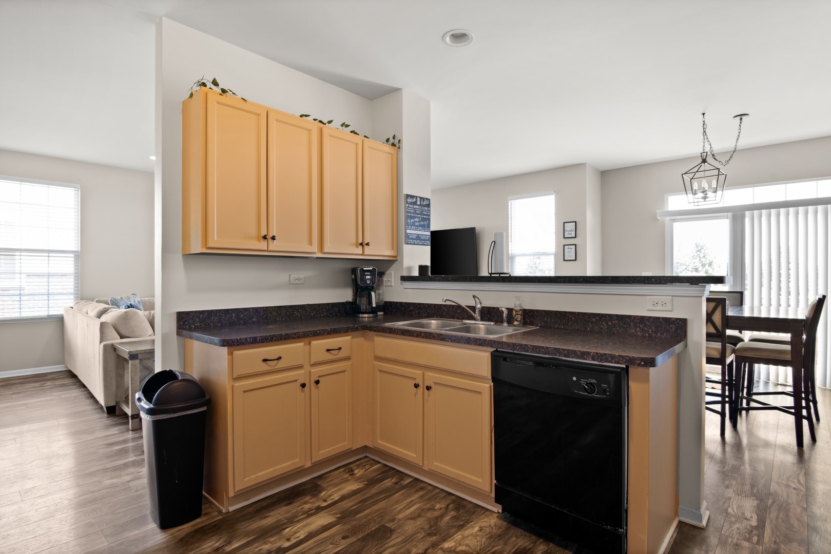 2919 Church Road Aurora, IL 60502 - Photo 9 of 28 a kitchen with a sink cabinets and window