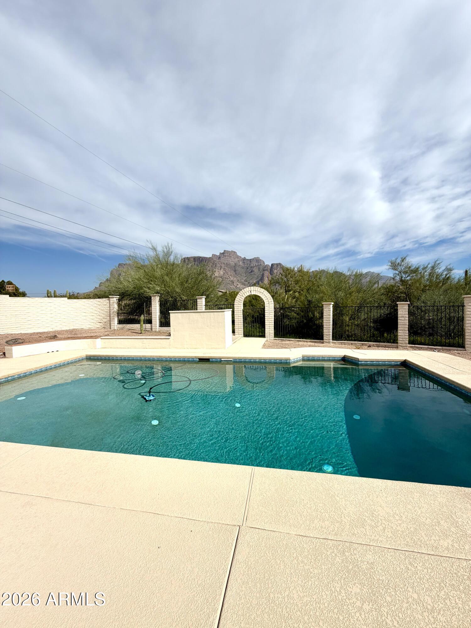 1165 North Mountain View Road Apache Junction, AZ 85119 - Photo 24 of 29 a view of swimming pool with outdoor space and seating area