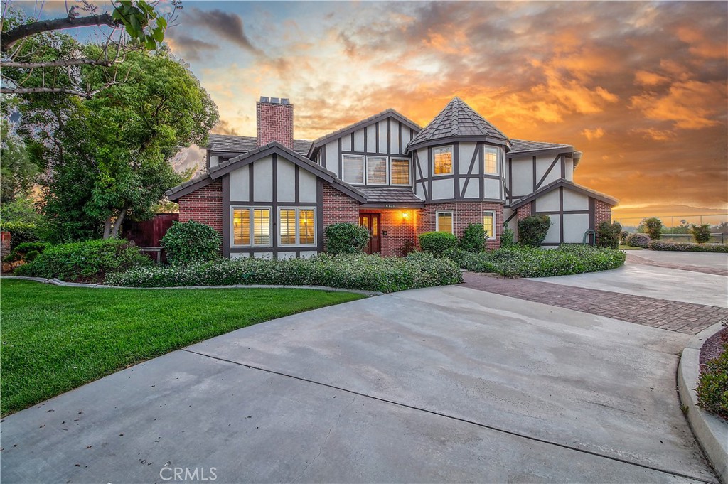 6735 Calais Court Riverside, CA 92506 - Photo 1 of 1 a front view of a house with a yard and garage