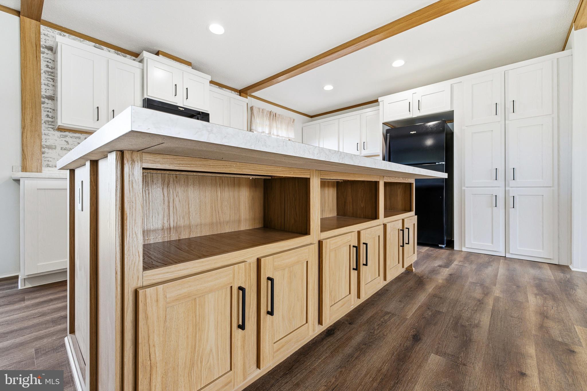 343 Park Road Stanley, VA 22851 - Photo 12 of 48 a hallway with stainless steel appliances wooden floors and wooden cabinets