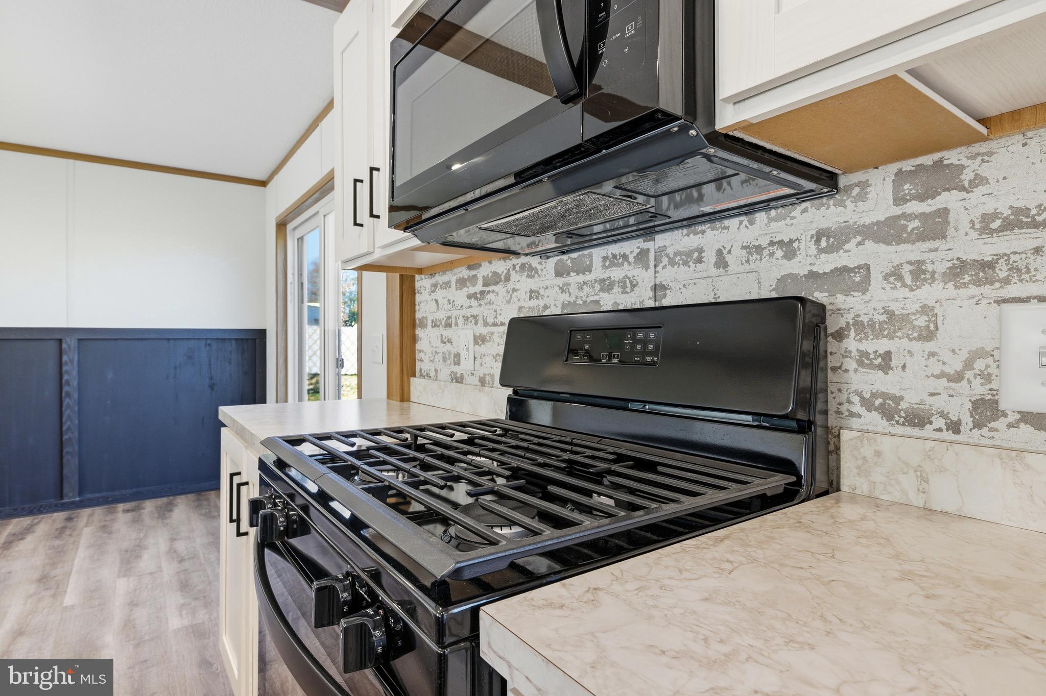 343 Park Road Stanley, VA 22851 - Photo 13 of 48 a stove top oven sitting inside of a kitchen