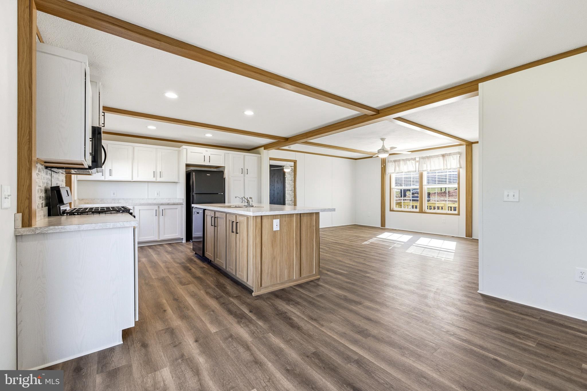 343 Park Road Stanley, VA 22851 - Photo 18 of 48 a kitchen with kitchen island wooden floors and stainless steel appliances