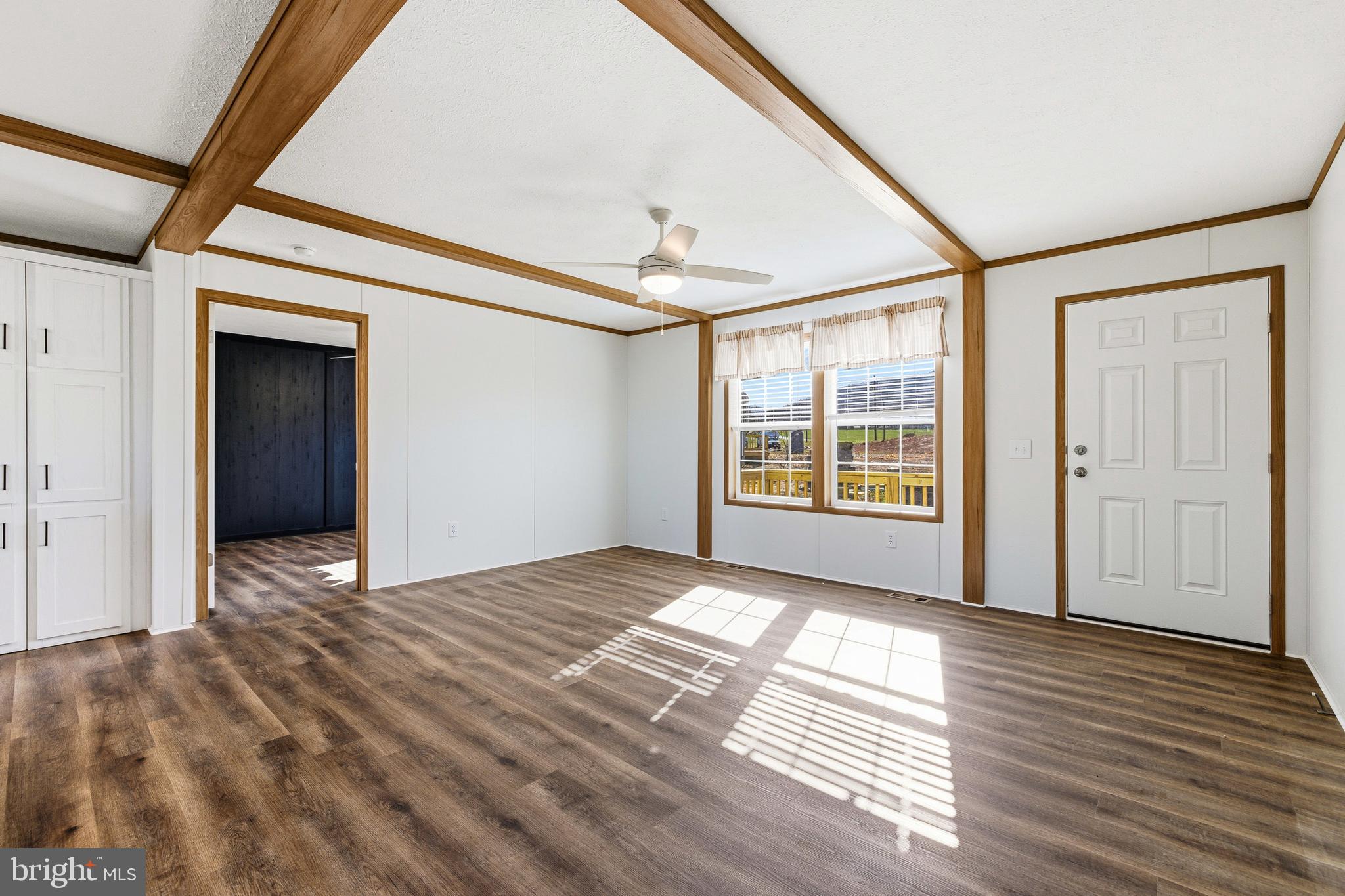 343 Park Road Stanley, VA 22851 - Photo 3 of 48 a view of an empty room with wooden floor and a window