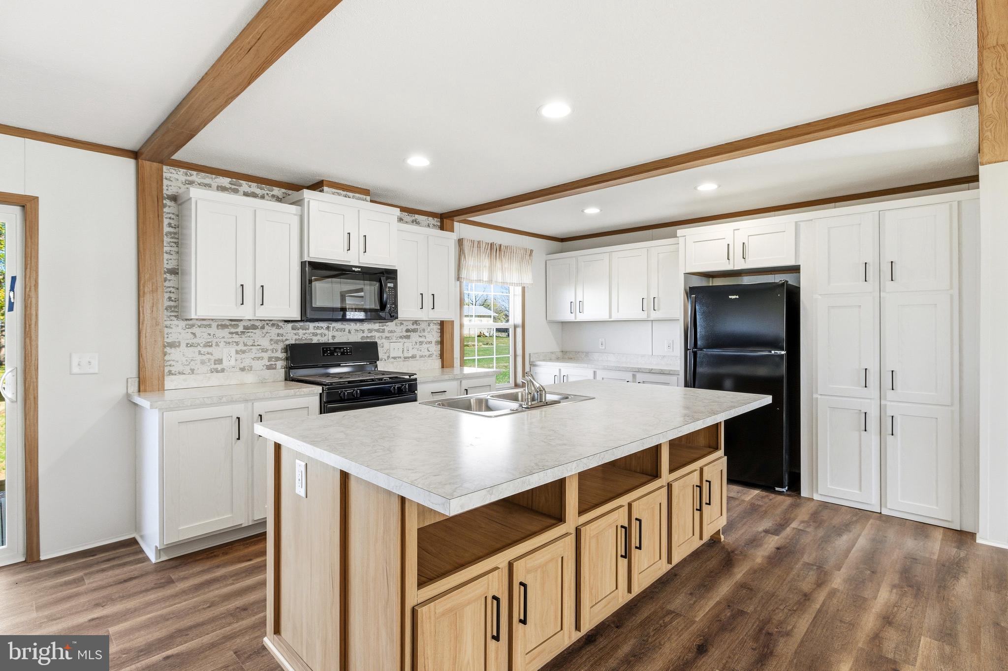 343 Park Road Stanley, VA 22851 - Photo 5 of 48 a kitchen with kitchen island a sink appliances and cabinets