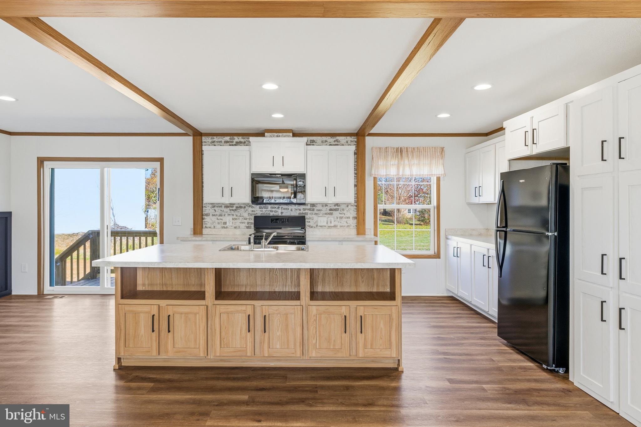 343 Park Road Stanley, VA 22851 - Photo 6 of 48 a large kitchen with kitchen island a large counter space a sink appliances and cabinets