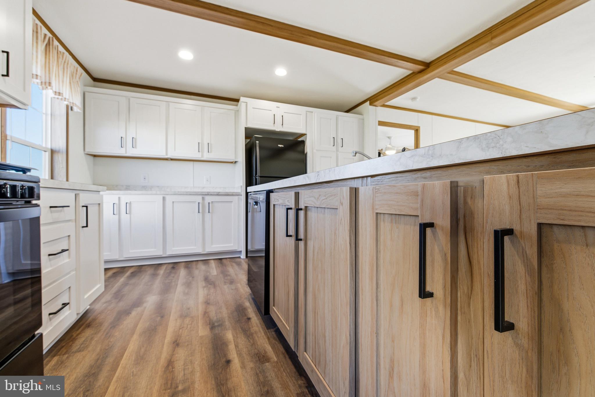 343 Park Road Stanley, VA 22851 - Photo 10 of 48 a kitchen with white cabinets and wooden floor