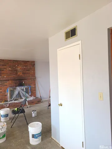 a bathroom with a sink a toilet and a window