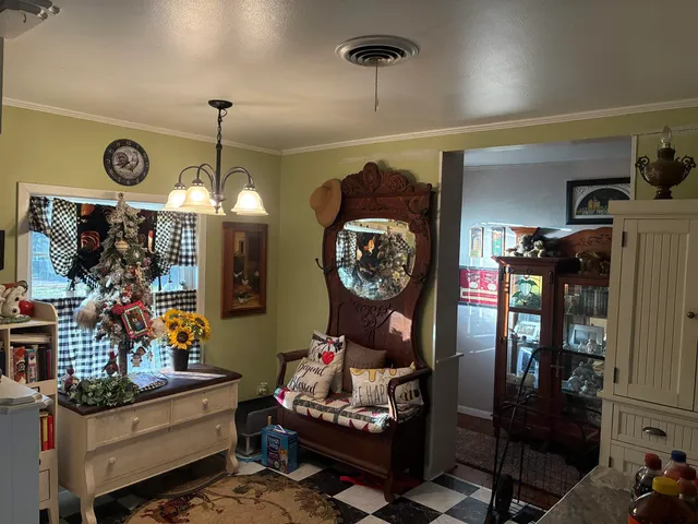 a living room filled with furniture and a chandelier