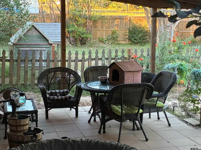 a view of a chairs and table in the balcony
