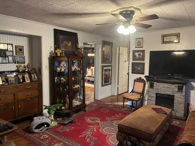 a living room with furniture and a flat screen tv