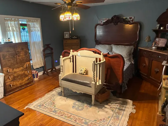 a bed room with a bed and a chandelier