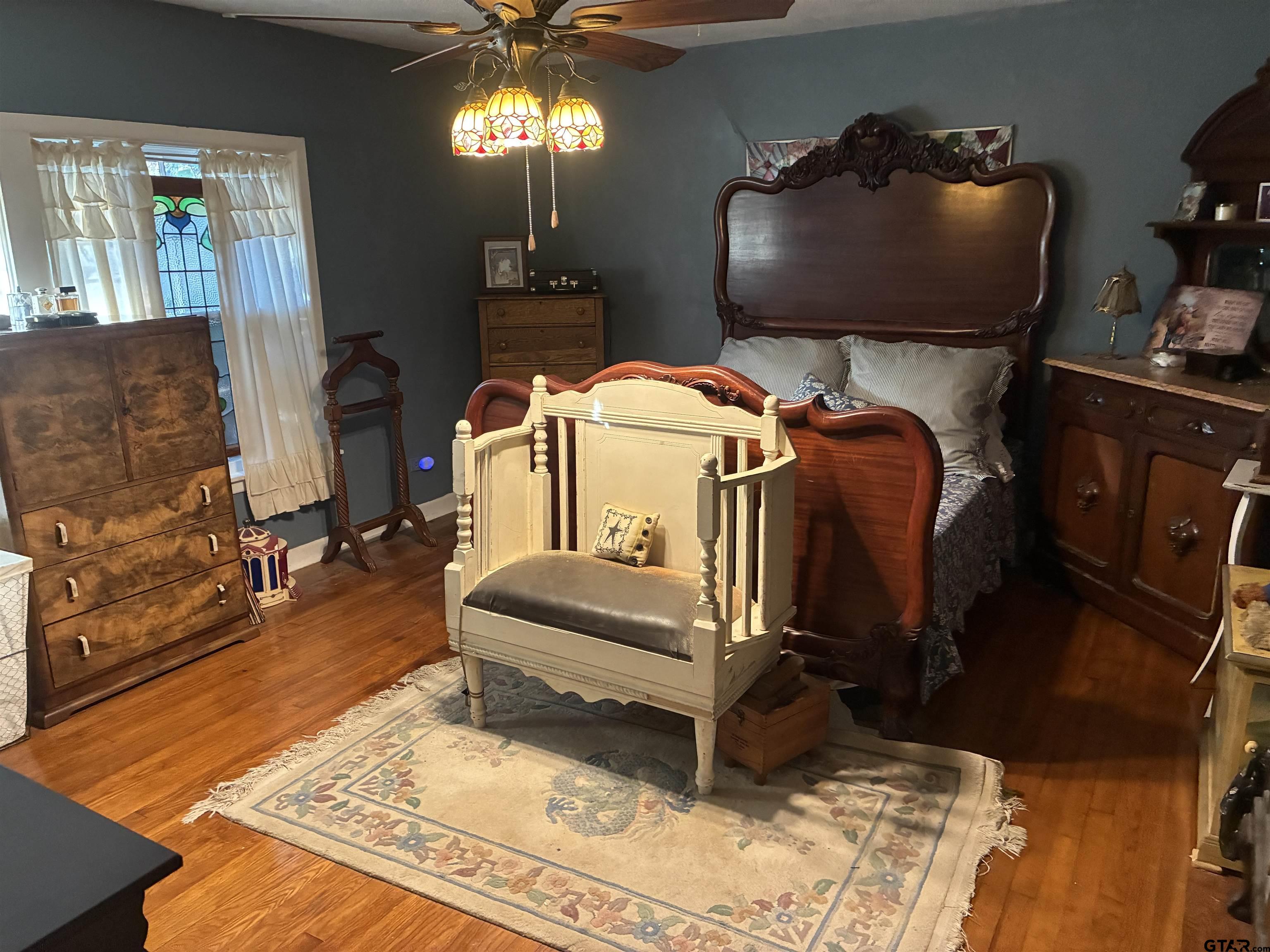 327 Fairview Street Rusk, TX 75785 - Photo 8 of 18 a bed room with a bed and a chandelier