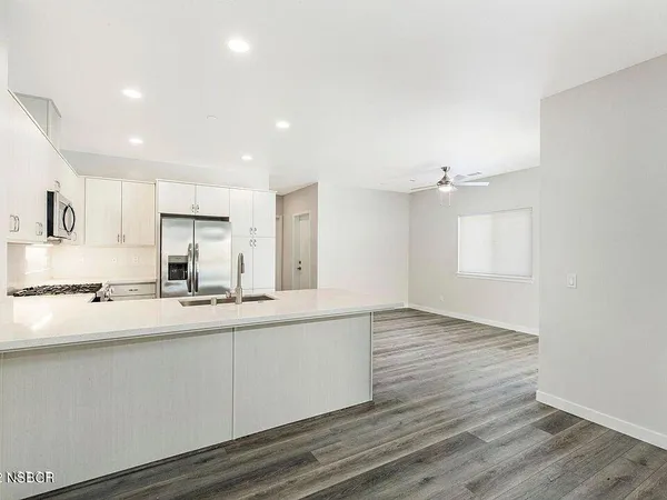 a view of kitchen with wooden floor