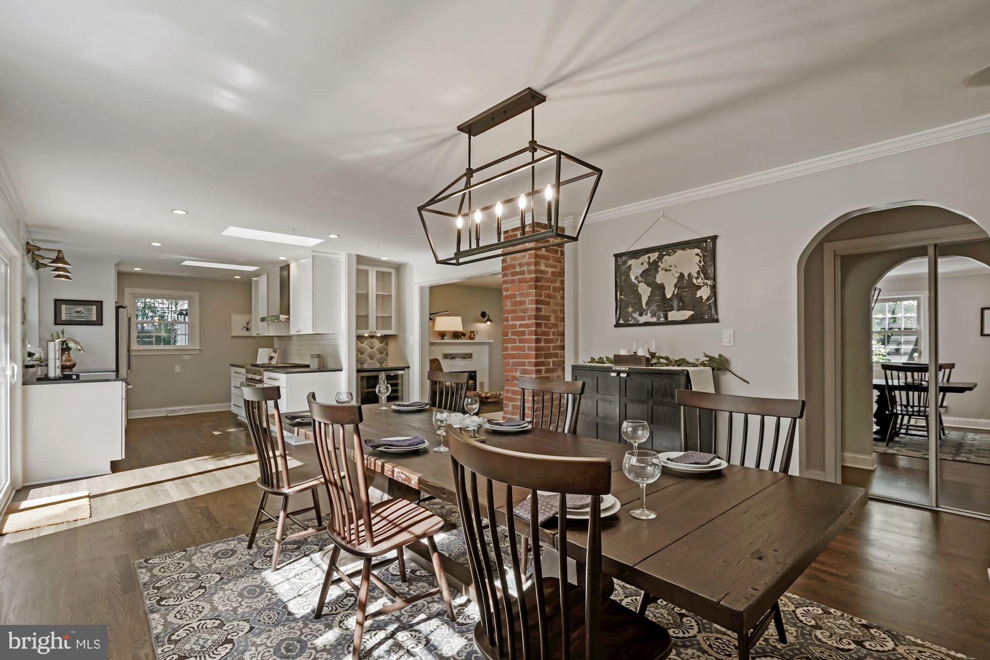 4921 Ridgewood Road Alexandria, VA 22312 - Photo 11 of 48 Custom lighting opens to state of the art kitchen