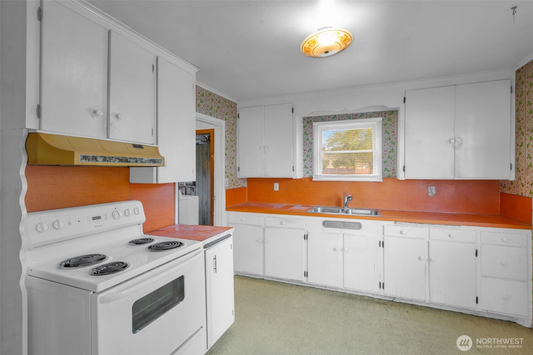 6926 East Cady Road Everett, WA 98203 - Photo 9 of 19 a kitchen with stainless steel appliances white cabinets and a sink