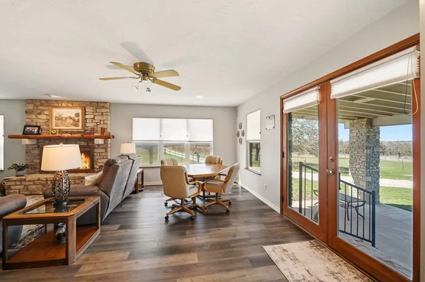 a living room with furniture and large windows