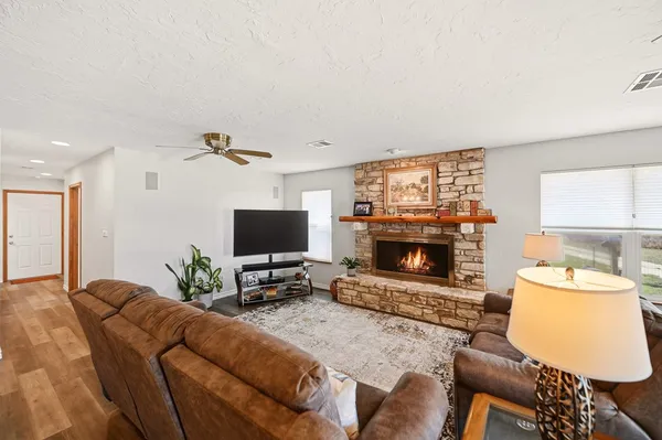 a living room with furniture and a fireplace