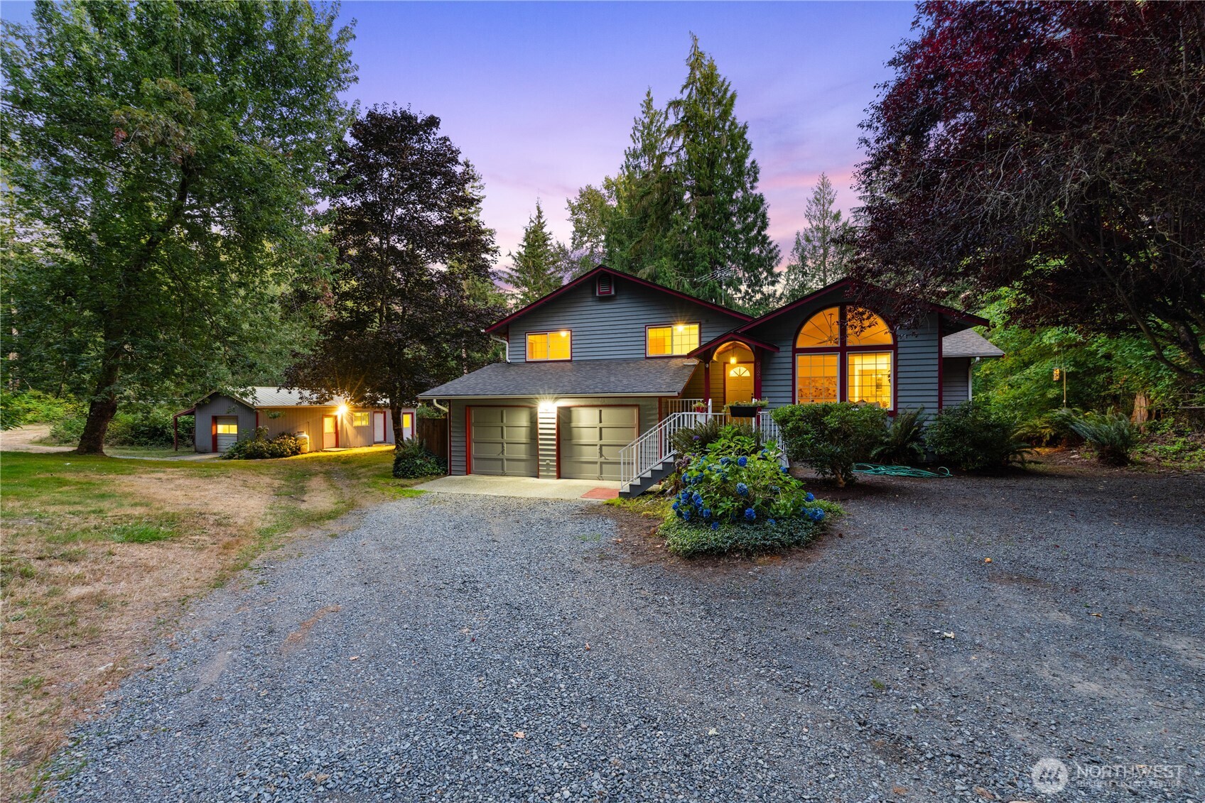 a front view of a house with a yard and garage