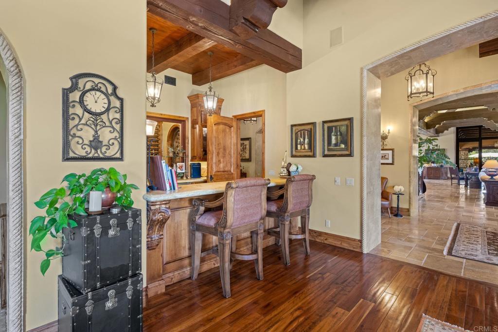 6314 El Apajo Rancho Santa Fe, CA 92067 - Photo 19 of 60 a view of a dining room with furniture and wooden floor