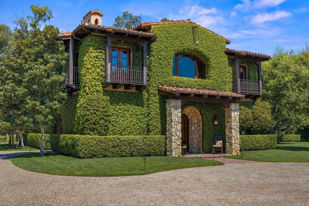 6314 El Apajo Rancho Santa Fe, CA 92067 - Photo 43 of 60 a view of a house with a small yard
