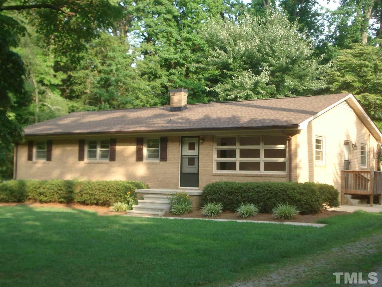 1221 Bill Poole Road Rougemont, NC 27572 - Photo 1 of 17 a front view of a house with a yard