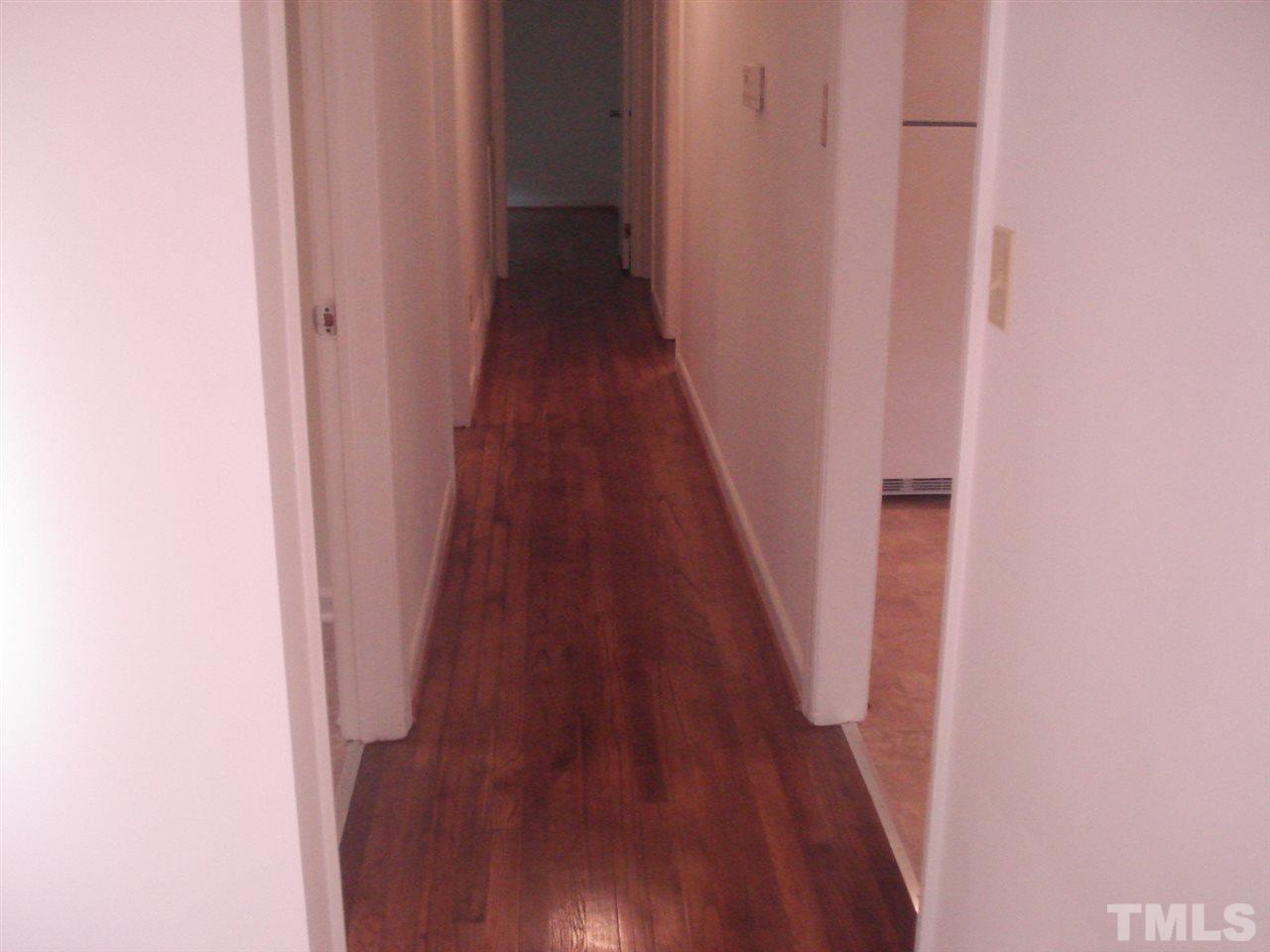 1221 Bill Poole Road Rougemont, NC 27572 - Photo 11 of 17 a view of a hallway with wooden floor