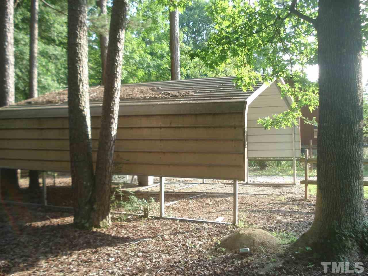1221 Bill Poole Road Rougemont, NC 27572 - Photo 5 of 17 a view of a house with a tree in the background