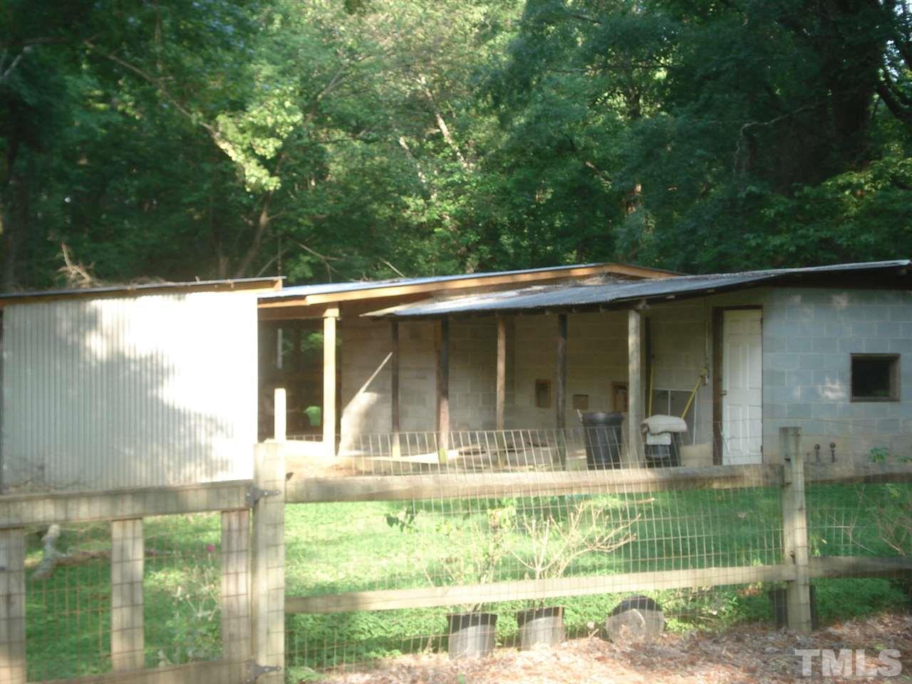 1221 Bill Poole Road Rougemont, NC 27572 - Photo 6 of 17 a view of house with backyard
