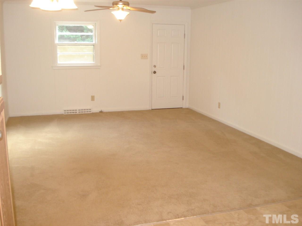 1221 Bill Poole Road Rougemont, NC 27572 - Photo 9 of 17 an empty room with a window