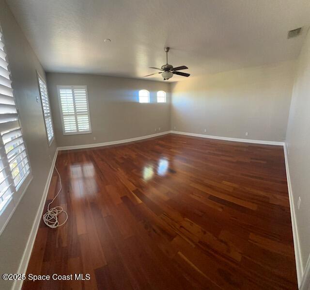 962 Balmoral Way Melbourne, FL 32940 - Photo 13 of 14 wooden floor in an empty room with a window