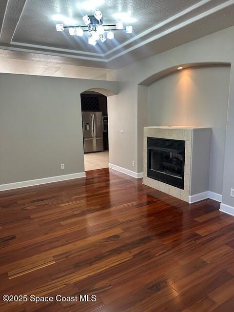 962 Balmoral Way Melbourne, FL 32940 - Photo 3 of 14 a view of an empty room with wooden floor fireplace and a window