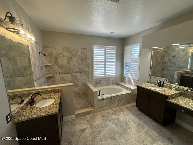 962 Balmoral Way Melbourne, FL 32940 - Photo 8 of 14 a spacious bathroom with a granite countertop tub sink a mirror and shower